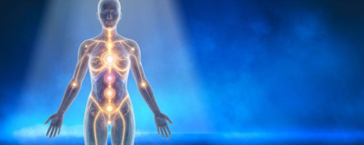 A human body illuminated by a glowing light emanating from above, giving a sense of energy and vitality.