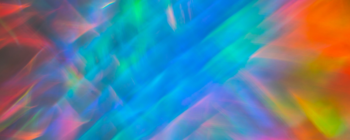 Abstract background featuring vibrant, colorful light patterns blending seamlessly.