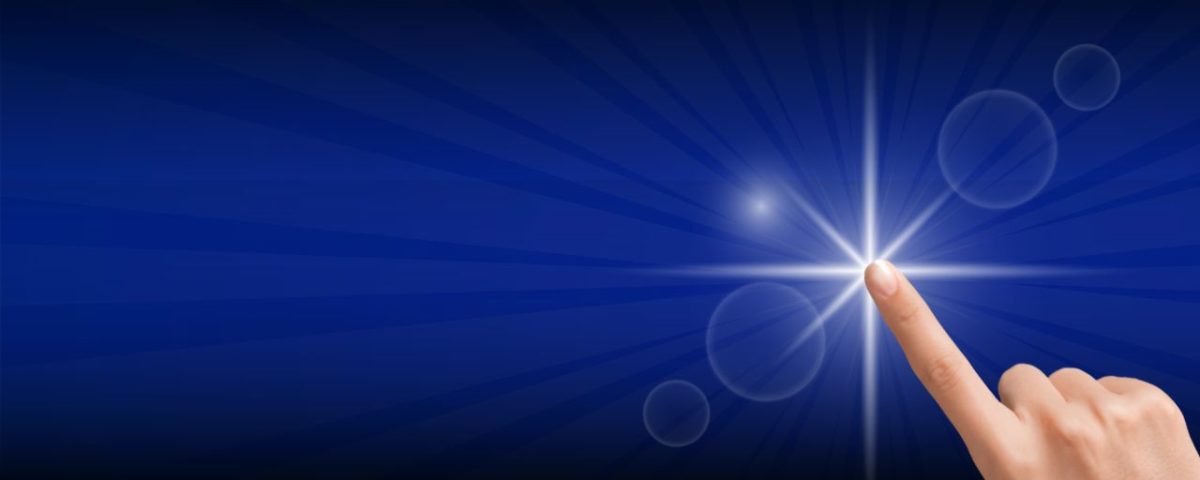 A hand pressing a button that looks like a bright white star against a vibrant blue background