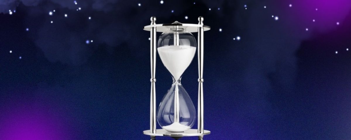 An hourglass filled with sand, set against a vibrant purple background, symbolizing the passage of time.