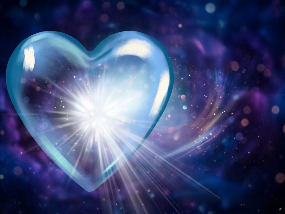 Light shines through a transparent heart in the cosmos, radiating light, producing a spectrum of colors on the surrounding area.