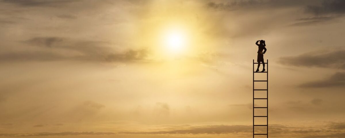 An individual on a ladder looks up at the sun, representing a pursuit of enlightenment and higher aspirations.
